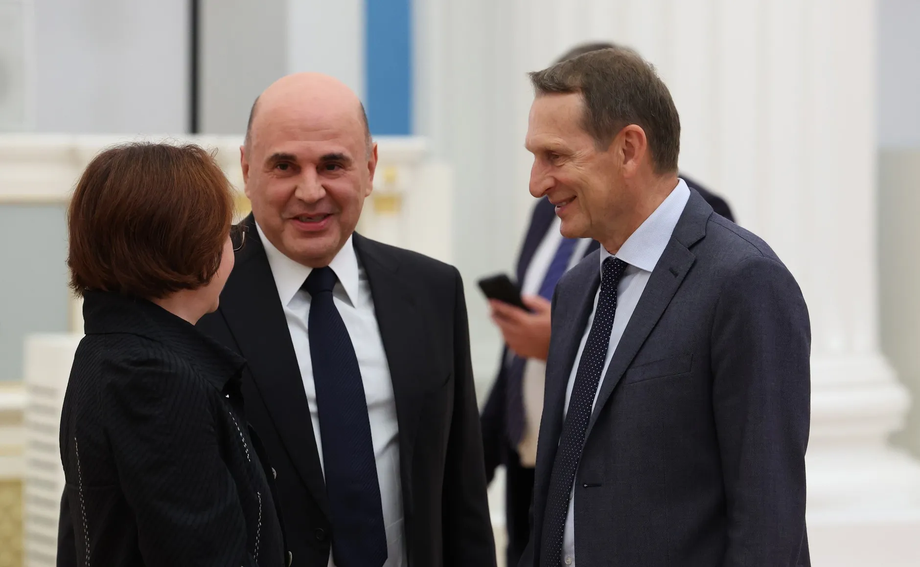 Central Bank governor Elvira Nabiullina, prime minister Mikhail Mishustin and SVR director Sergei Naryshkin (right) before the meeting on the outcome of the Russian-American summit in Anchorage, August 16, 2025. Photo: kremlin.ru. Licence: CC BY 4.0. Source: Wikimedia Commons